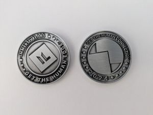 Two Immersive Labs Community Challenge Coins side by side