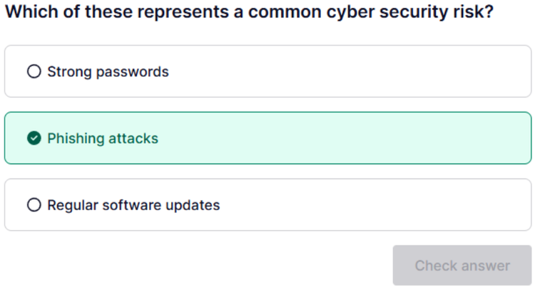 A screenshot of a multiple-choice question. The question asks, "Which of these represents a common cyber security risk?" with the following options: Strong passwords, Phishing attacks, and Regular software updates. The correct answer, "Phishing attacks," is selected and highlighted in green.